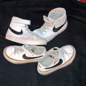Two pairs low tops and high top nikes